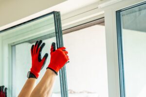 Professional technician providing professional window service in Sarasota for a residential home